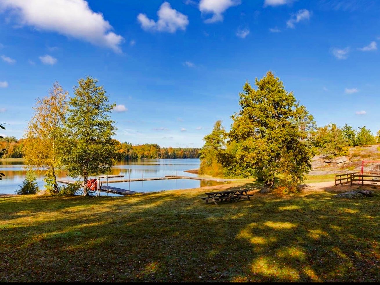 Paddle board on the calm lake near the cabin